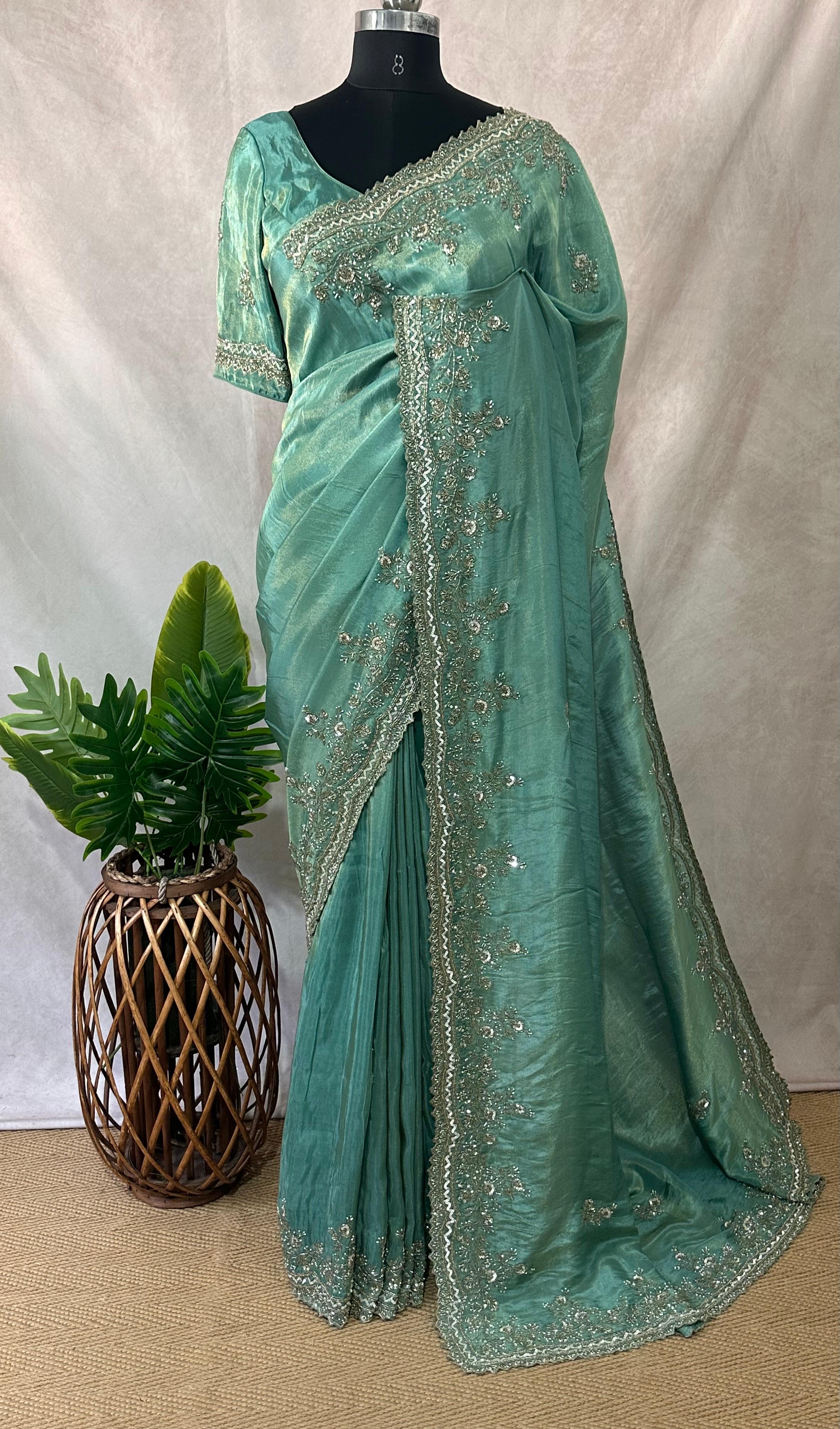 Green tissue designer saree with stitched blouse and under skirt
