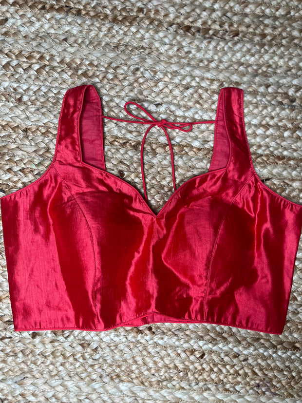 Coral color silk sleeveless blouse