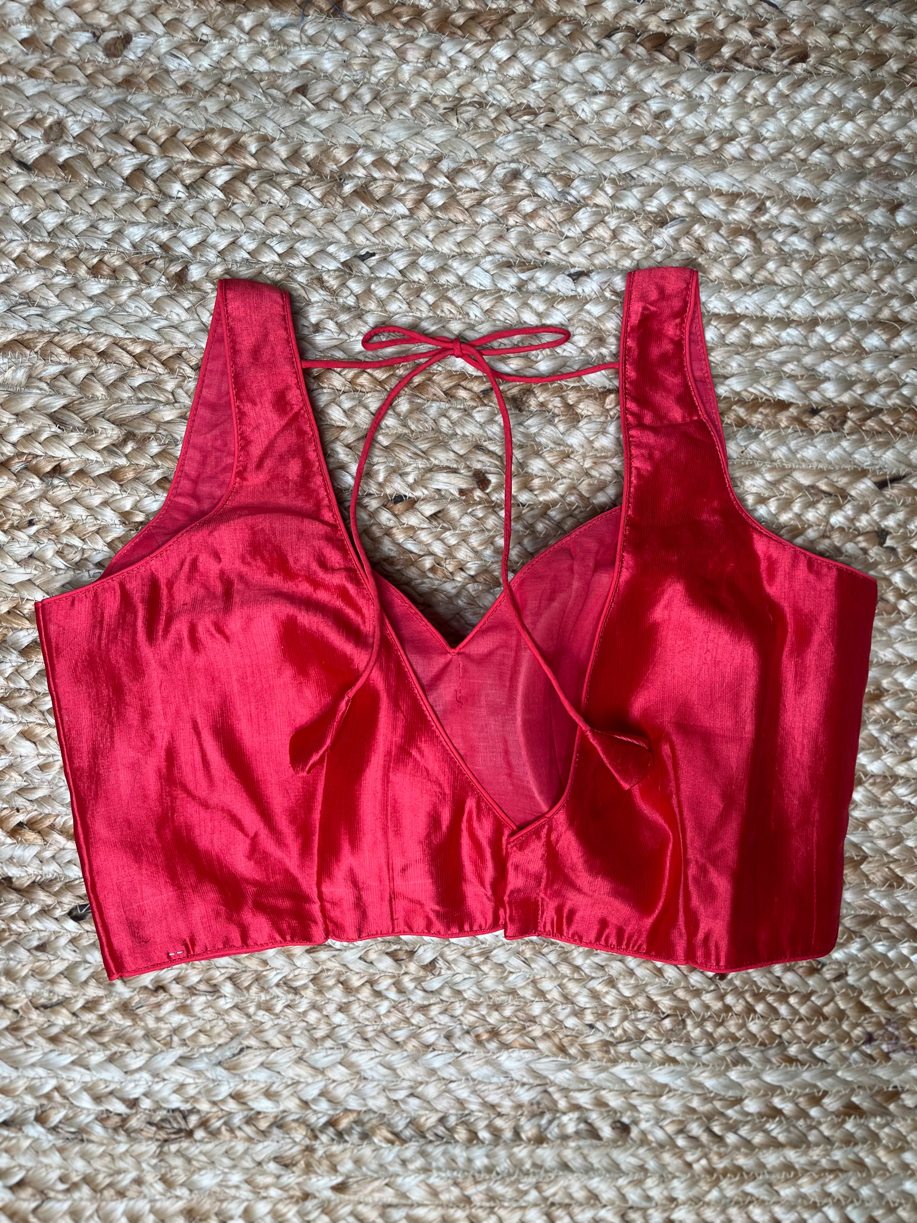 Coral color silk sleeveless blouse