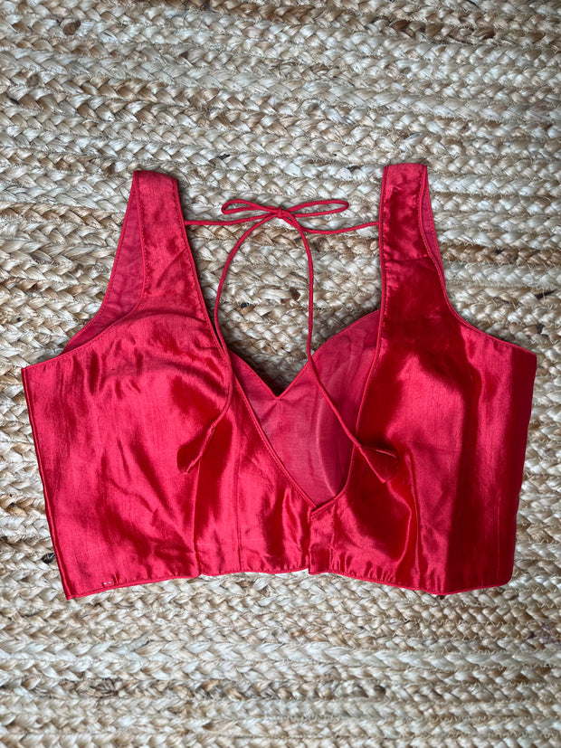 Coral color silk sleeveless blouse