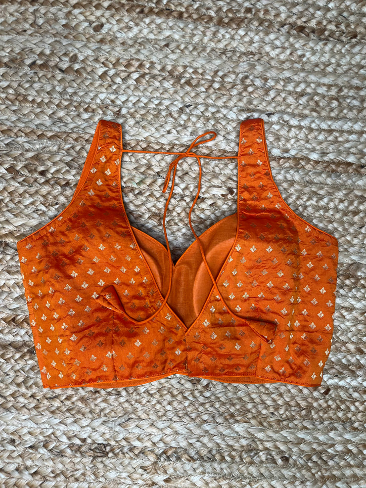 Orange sleeveless blouse