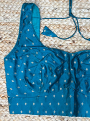 Peacock green sleeveless blouse