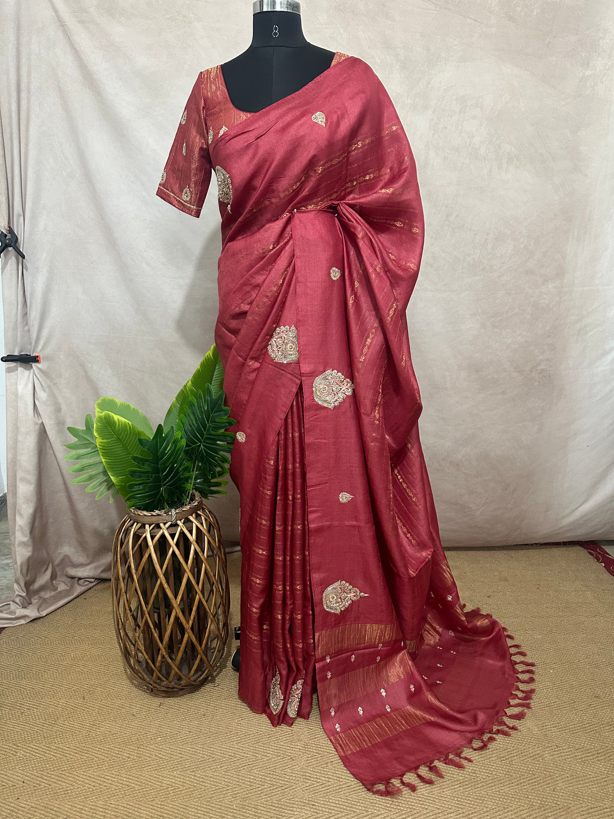 Coral color pure tussar silk saree with hand work and stitched blouse