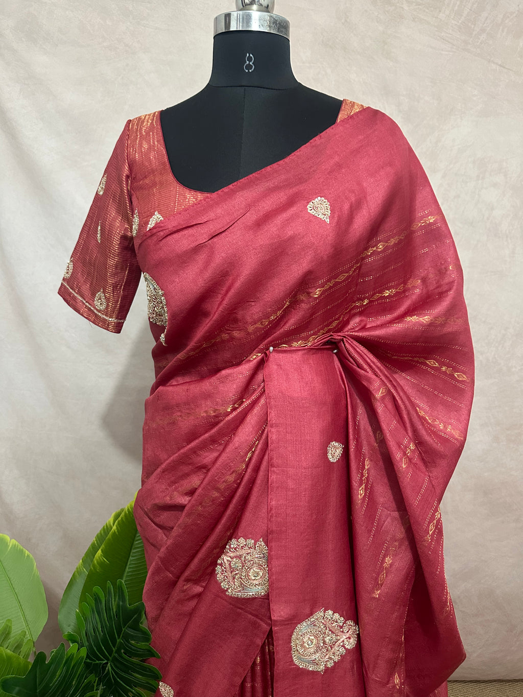 Coral color pure tussar silk saree with hand work and stitched blouse