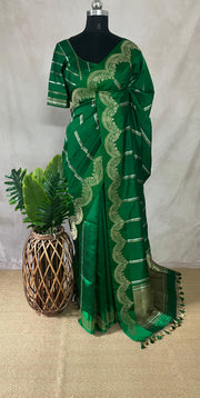 Green soft katan silk saree with silver border, with stitched blouse