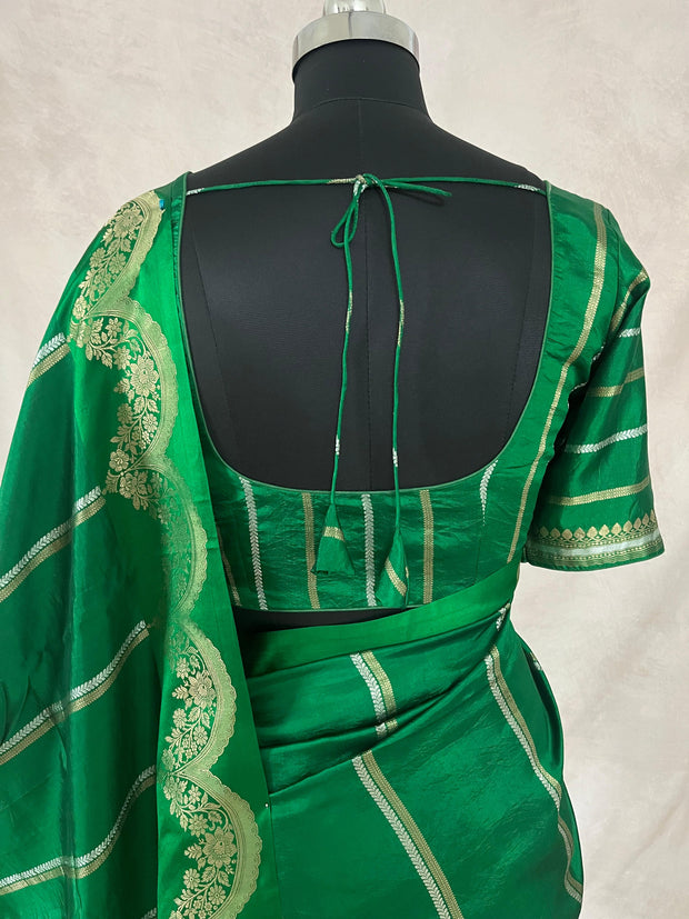 Green soft katan silk saree with silver border, with stitched blouse