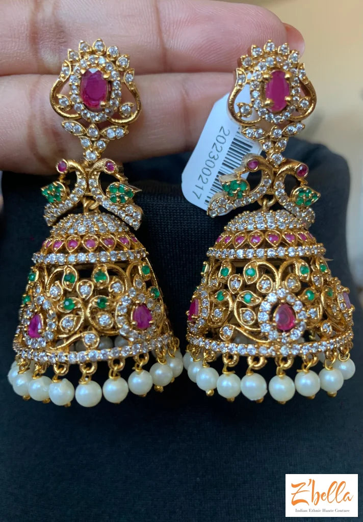Big Jhumka With Red And White Stones Earrings Gold Tone