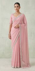 Light pink georgette saree with bead embroidery and stitched blouse
