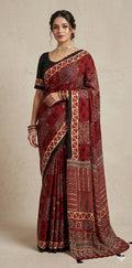 Designer Ajrakh modal silk saree with bead and mirroer handwork, stitched blouse