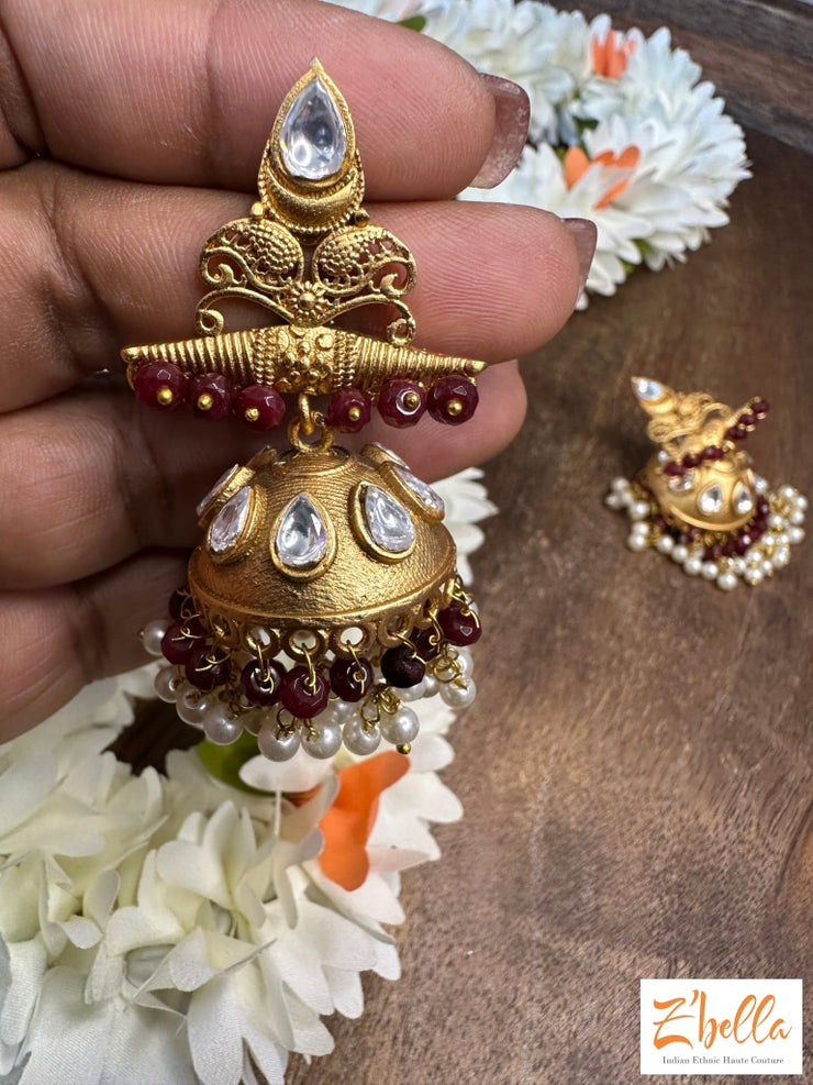 Gold Jhumka With Red Beads Earrings Tone