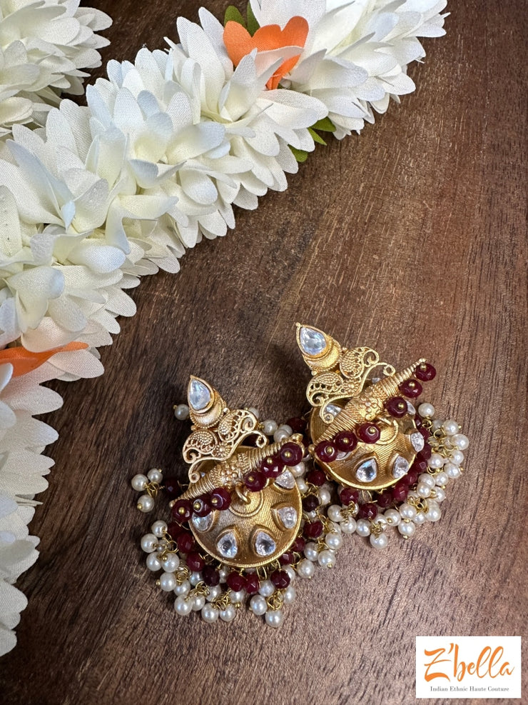 Gold Jhumka With Red Beads Earrings Tone
