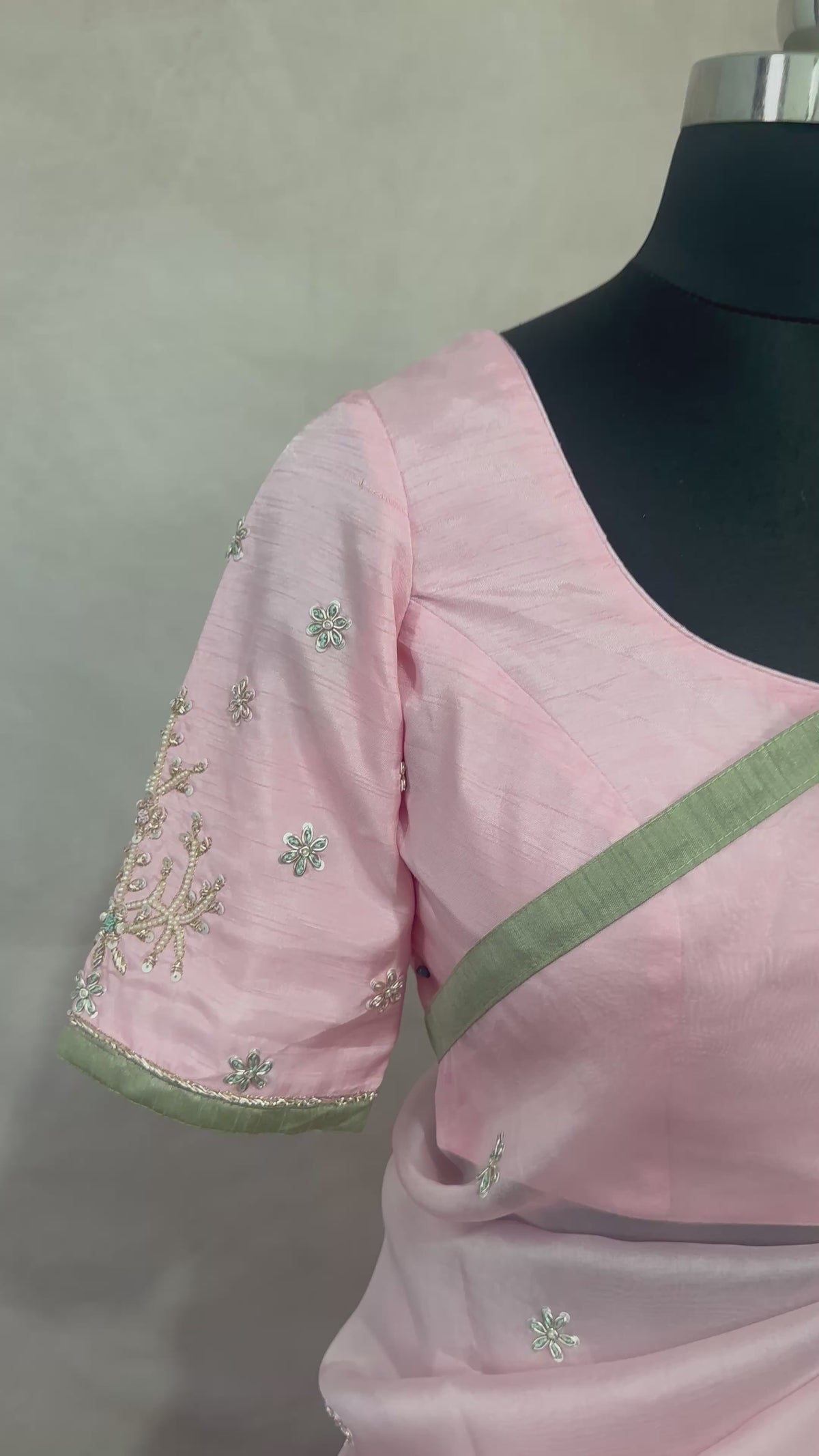 Pastel pink and green designer organza saree with stitched blouse