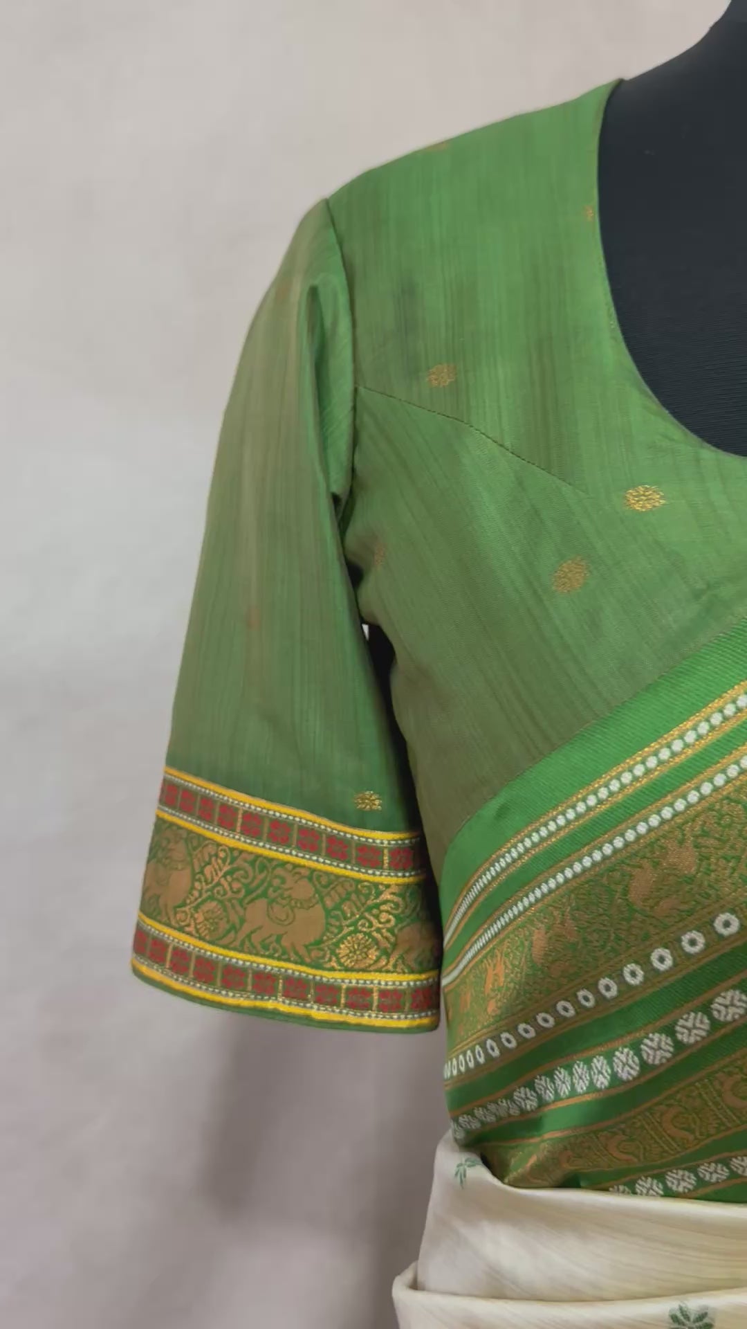 Asam silk saree with green border and stitched blouse