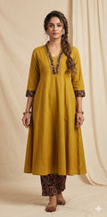 Mustard yellow cotton kurti with handwork on back neck, includes bottoms