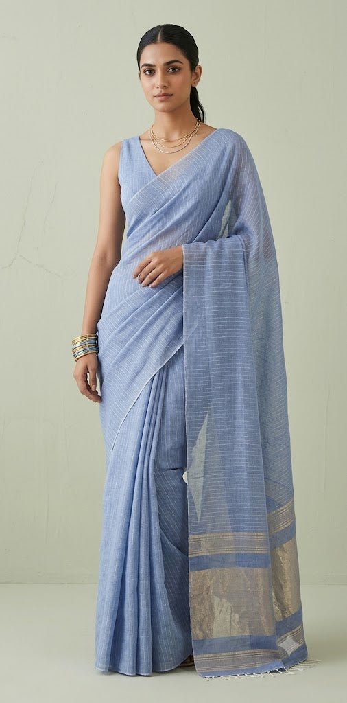 Handloom Light blue cotton saree with gold line, with stitched blouse