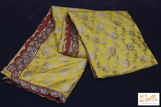 Yellow Banarsi Jaal Weave With Red Embroidery Border Stitched Blouse Saree