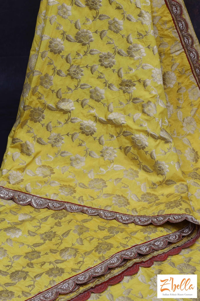 Yellow Banarsi Jaal Weave With Red Embroidery Border Stitched Blouse Saree