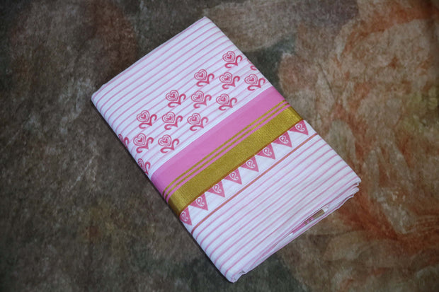 Set saree with pink print and gold border, and waved lined on the body