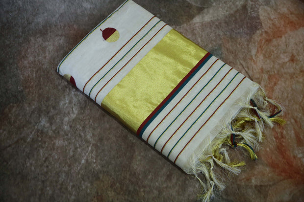 Hadwoven tissue set saree with gold green and maroon buttas