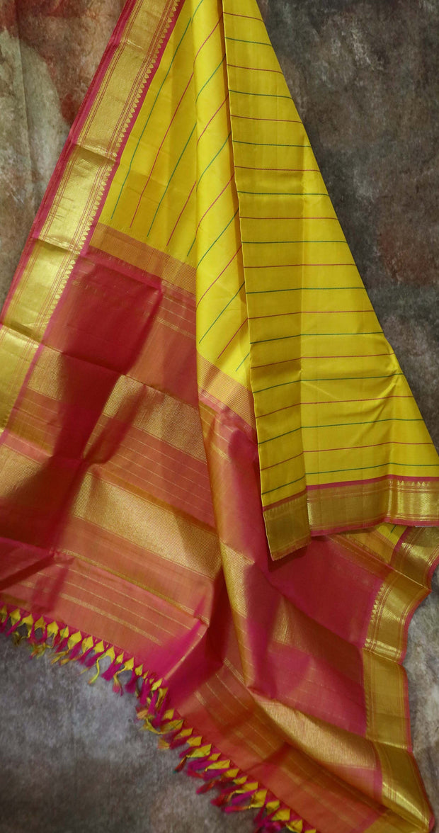 Yellow kanchipuram silk hand woven saree with stitched blouse