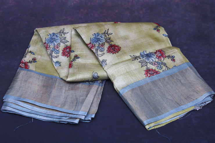 Floral printed light Olive green tussar silk saree with grey border, stitched blouse