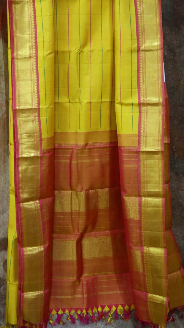 Yellow kanchipuram silk hand woven saree with stitched blouse