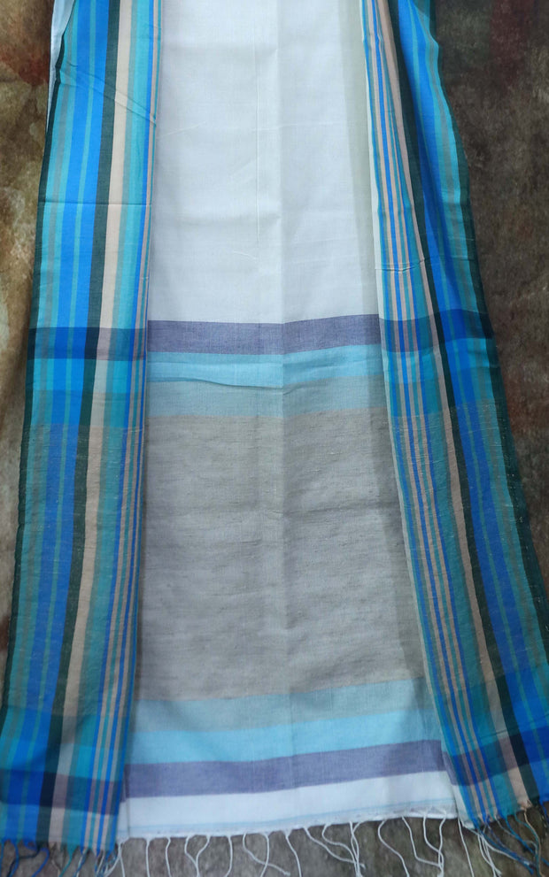 Offwhite cotton saree, with sleeveless designer blouse with embroidery.